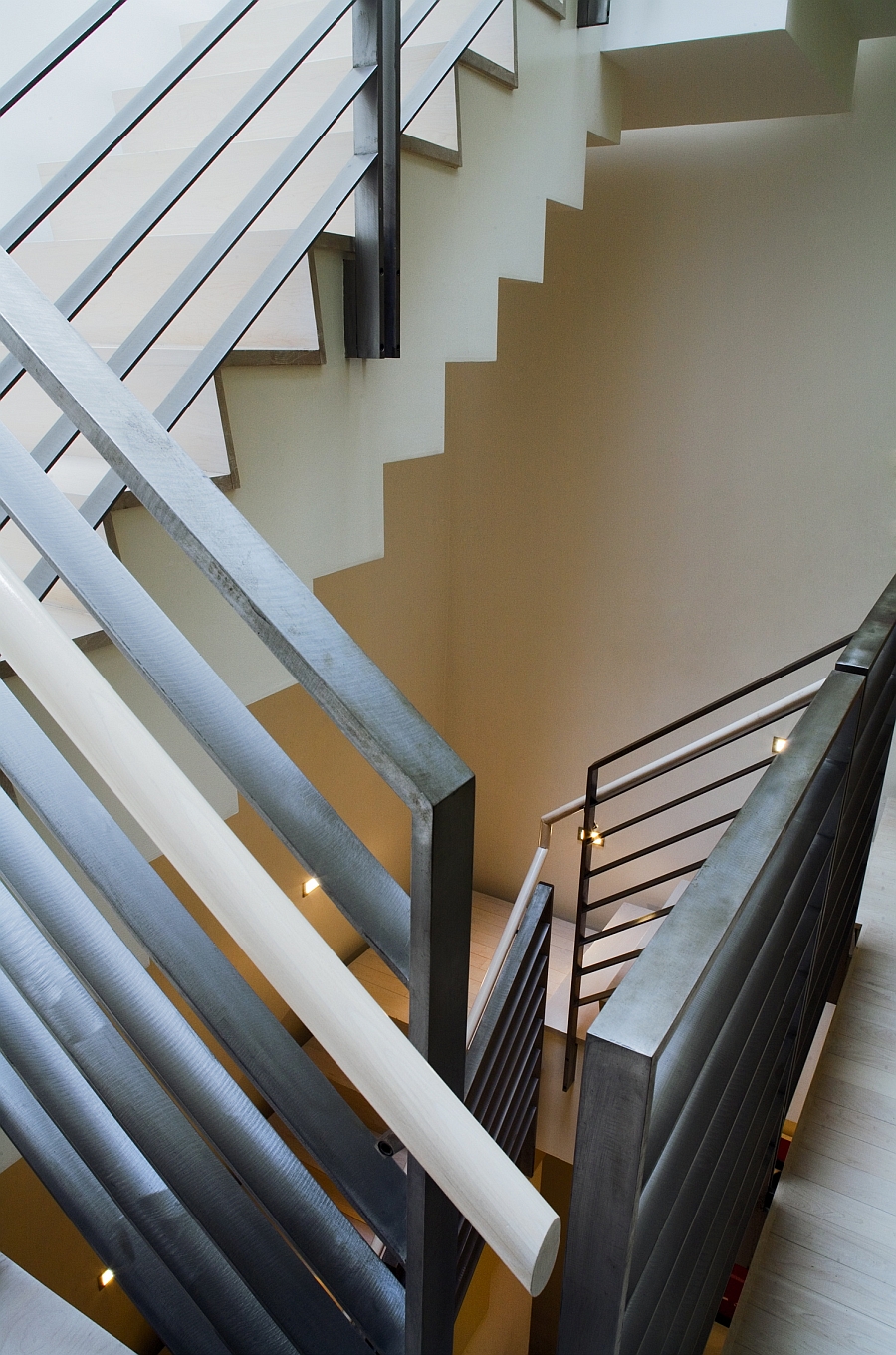 Sculptural staricase connects the four levels of the townhouse