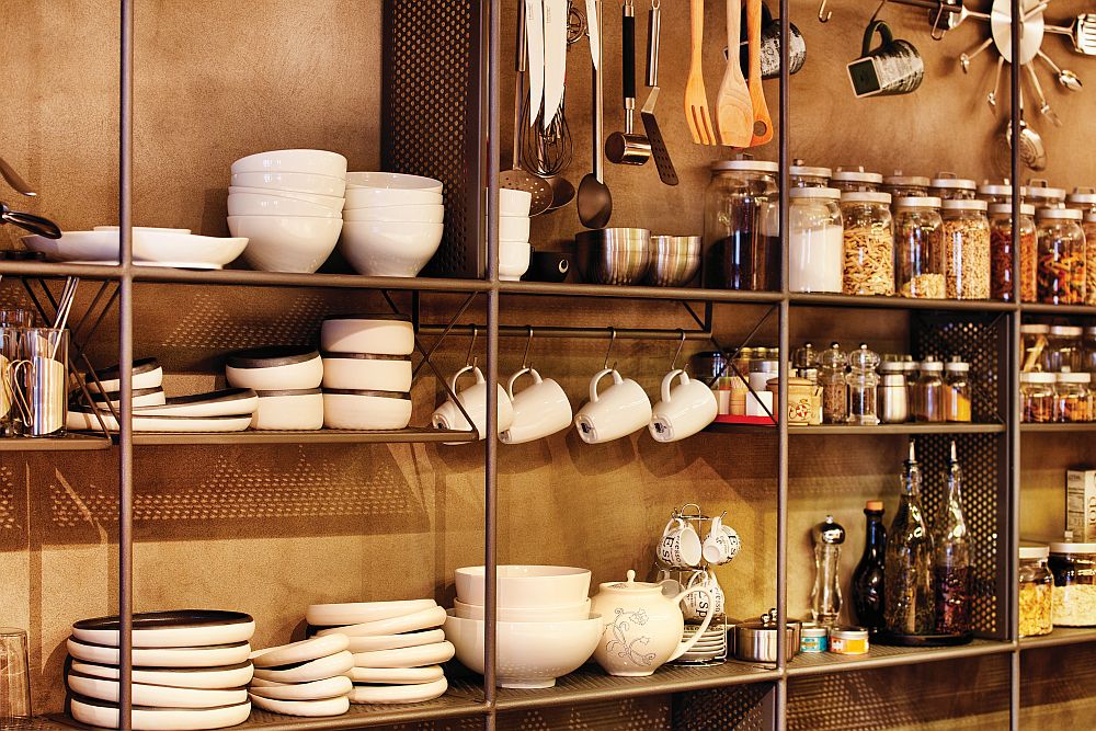 Simple and extensive storage system with iron rods and shelves in the kitchen