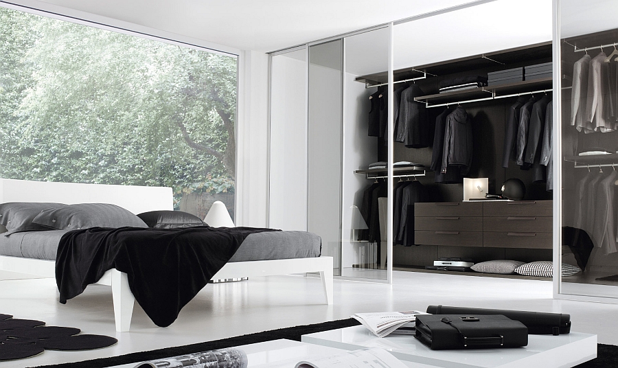 Sleek and stylish bedroom in black and white with a walk-in closet