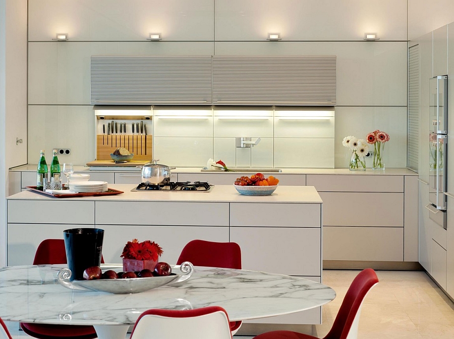 Sleek contemporary kitchen in white with smart shelves