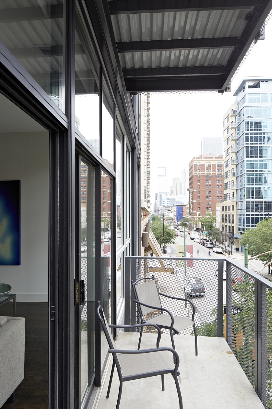 Small balcony offers a bird eyeview of the busy street below