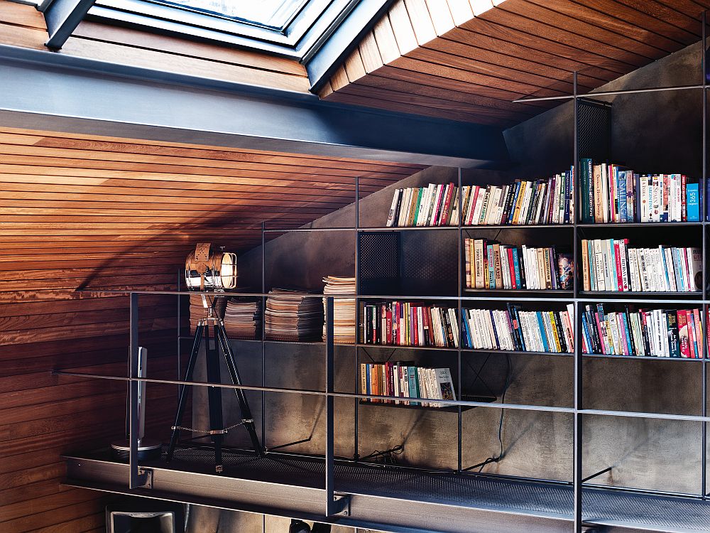 Smart and simple storage system doubles as home library on the mezzanine level