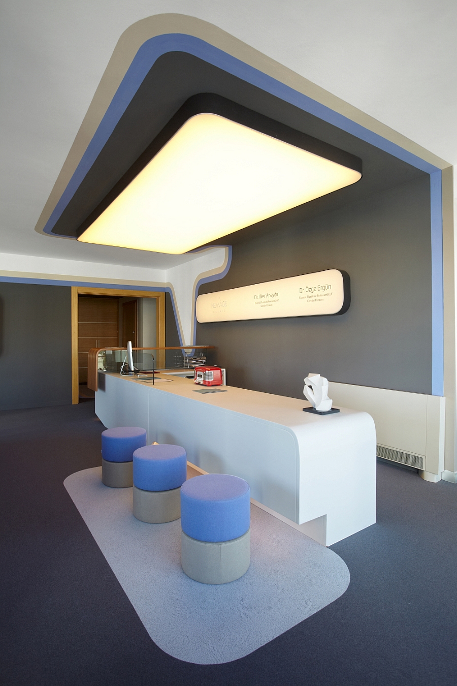 Specially crafted reception desk welcomes the clientele at the clinic