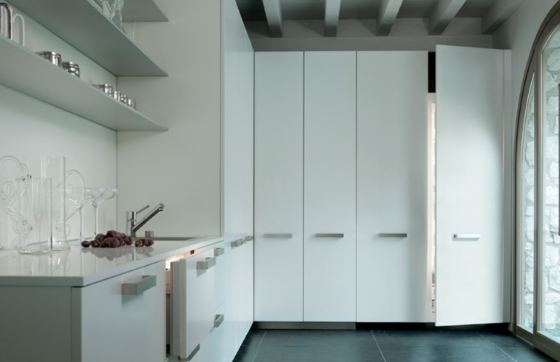 Stainless steel shelving above a kitchen sink