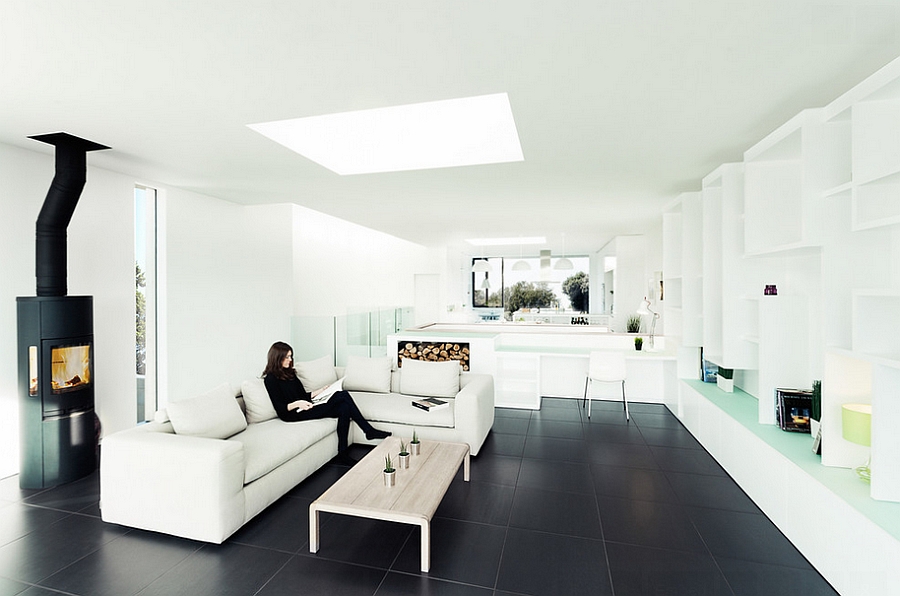 Stylish minimal living room with black tile floor