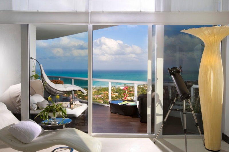 Tropical bedroom with a balcony view