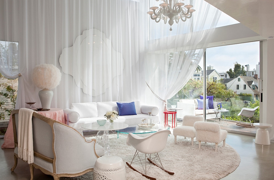 White drapes and cozy decor give the spacious room a trendy, feminine look [Design: BNO]