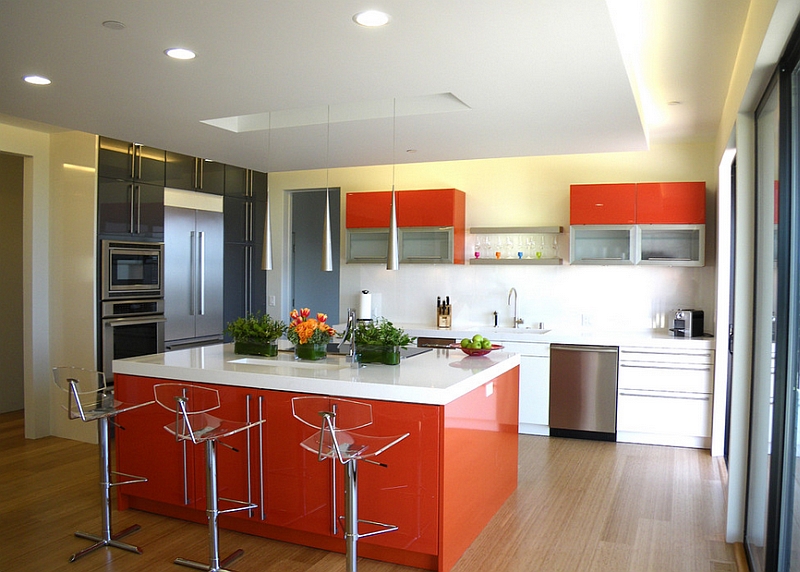 A touch of bright tangerine and black in the kitchen [Design: Mark English Architects]