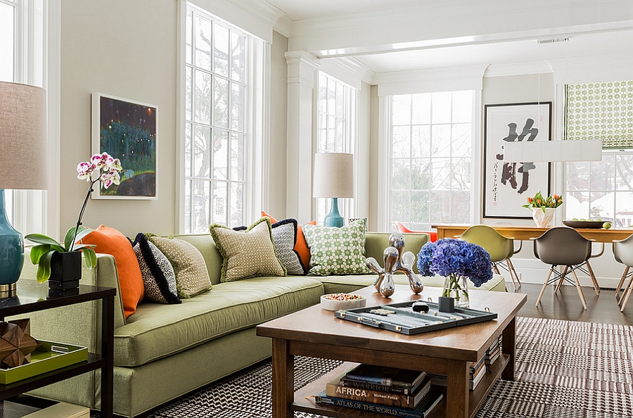 Add a subtle touch of black and orange with throw pillows [By: Terrat Elms Interior Design]