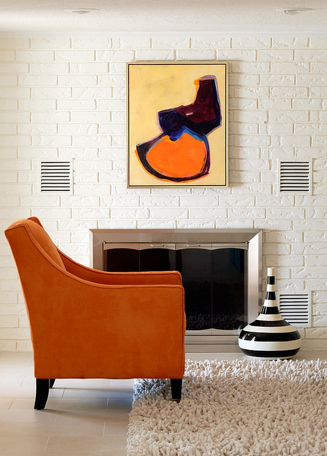 Art piece accentuates the color scheme of the room [By: Tobi Fairley Interior Design]