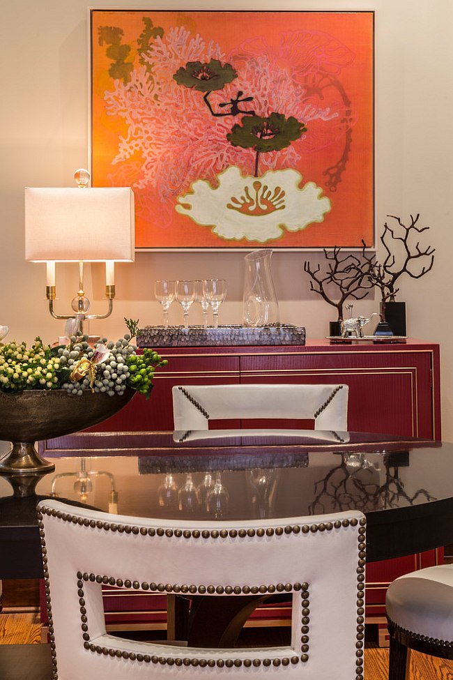 Art work adds bright orange to the dining room