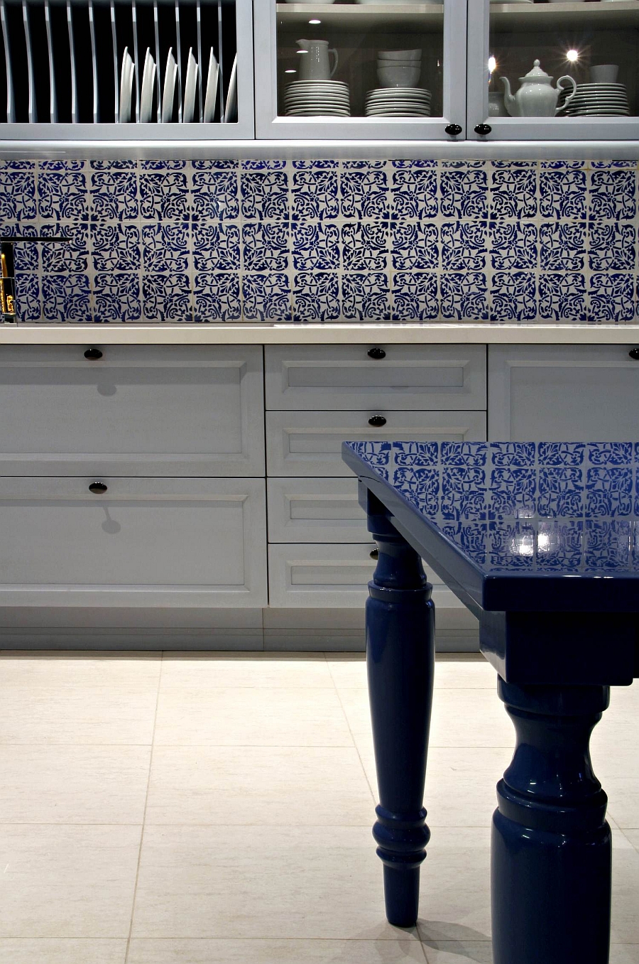 Beautiful shelves, wall tiles and table give the setting a classic appeal