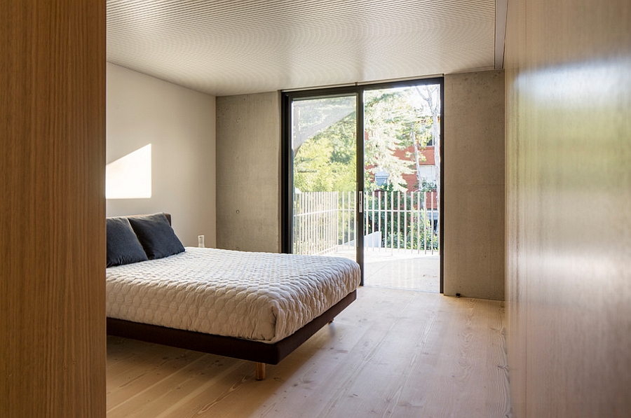 Bedroom that is connected to the small balcony outside