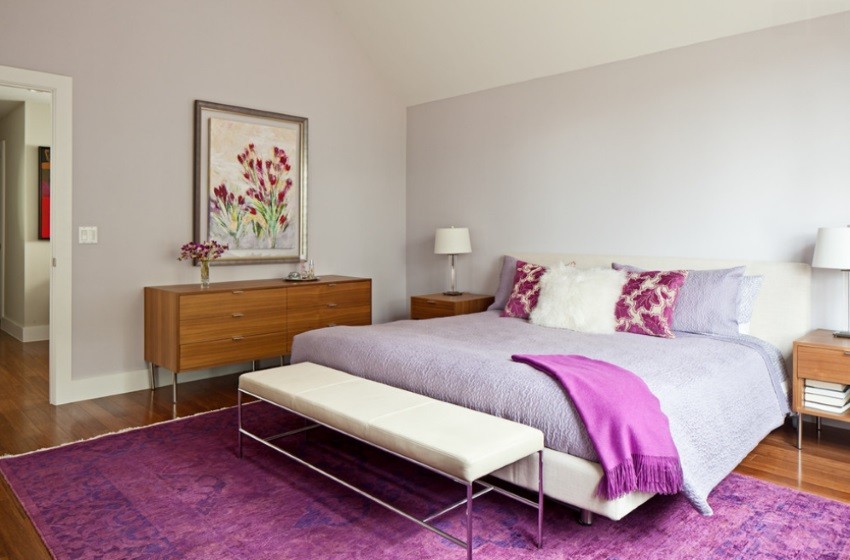 Bedroom with an over-dyed rug in shades of purple