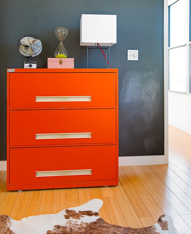 Bright orange cabinet stands out visually in any space it adorns