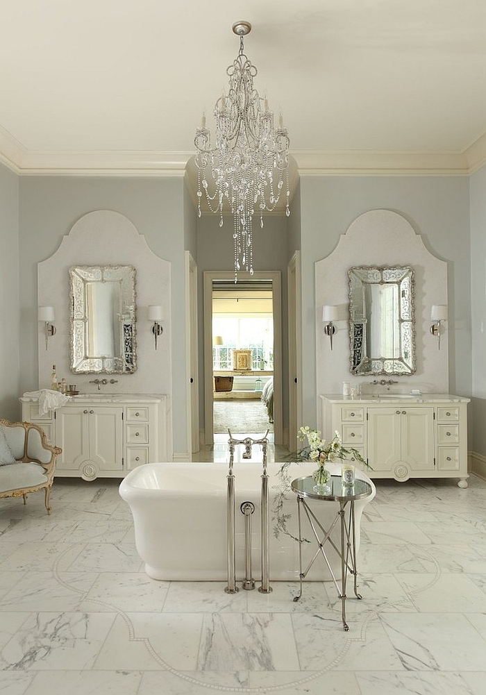 Classic chandeliers seem right at home in the feminine bathroom [Design: The Iron Gate]