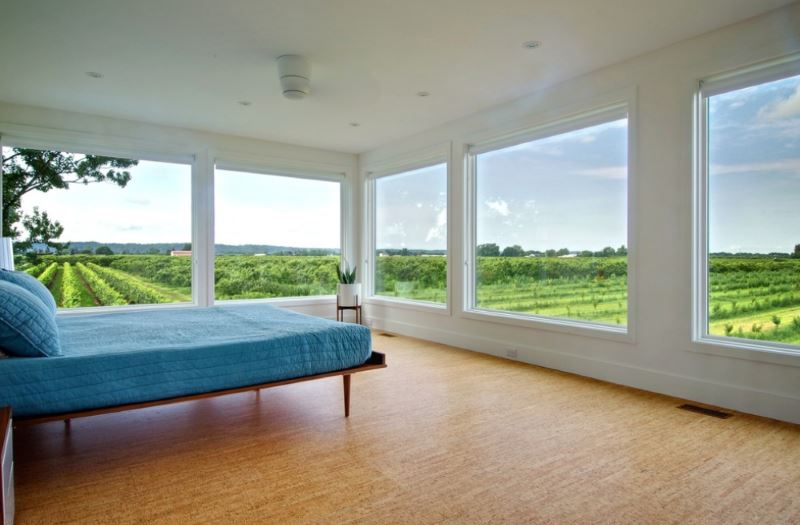 Cork flooring in a bedroom with a vineyard view