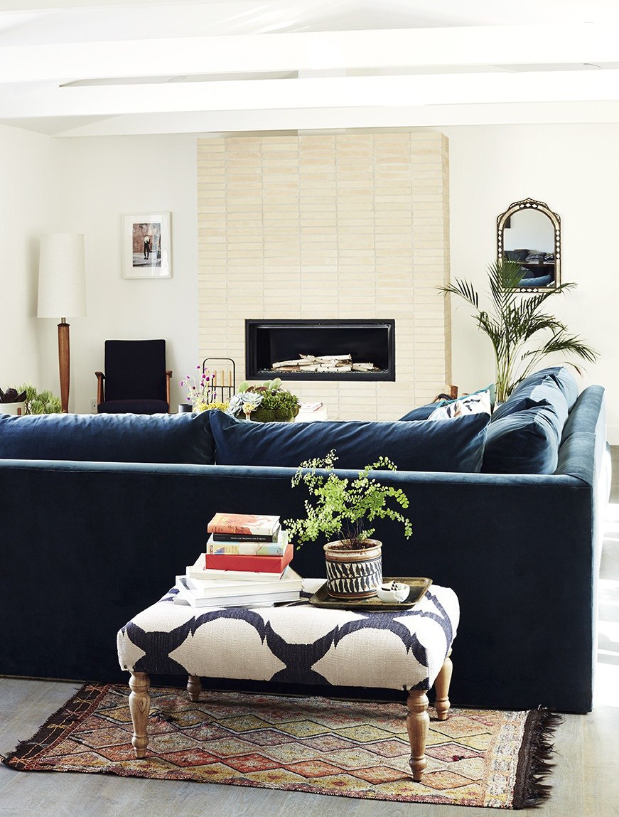 Deluxe sofa in a living room with a modern fireplace