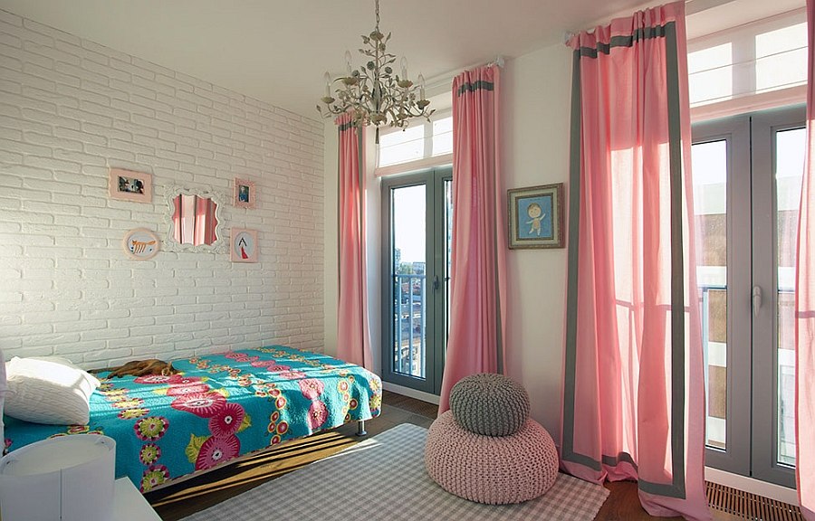 Exposed brick wall and kinitted decor add textural contrast to the room