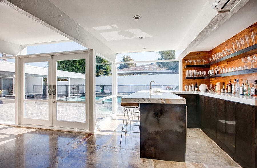 Fabulous home bar design that is accessible from the pool area outside