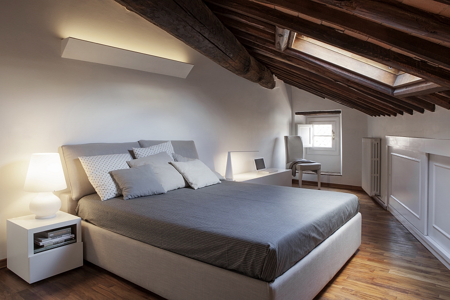 Gorgeous master bedroom with a slanted ceiling