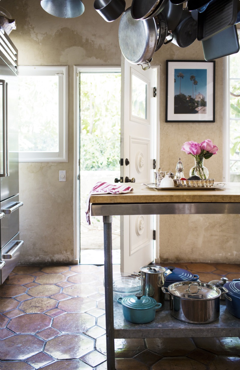 Hanging pot rack in an eclectic kitchen