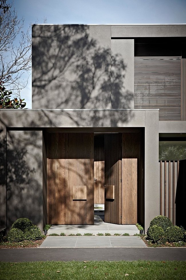 Heavy wooden doors bring a unique element to the modern extreior