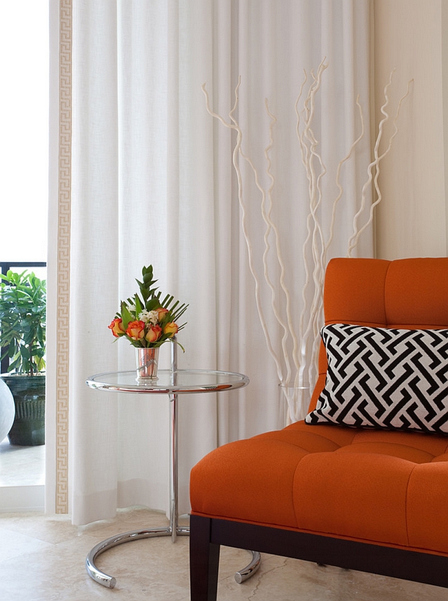 Infuse some orange zest into your bedroom with an orange accent chair [Design: NXG Studio]