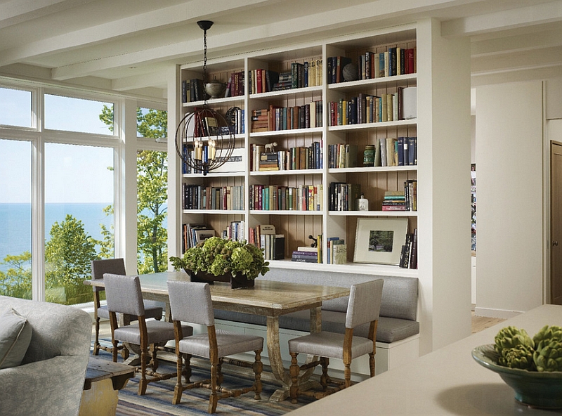 Interesting dining space design with a bookshelf