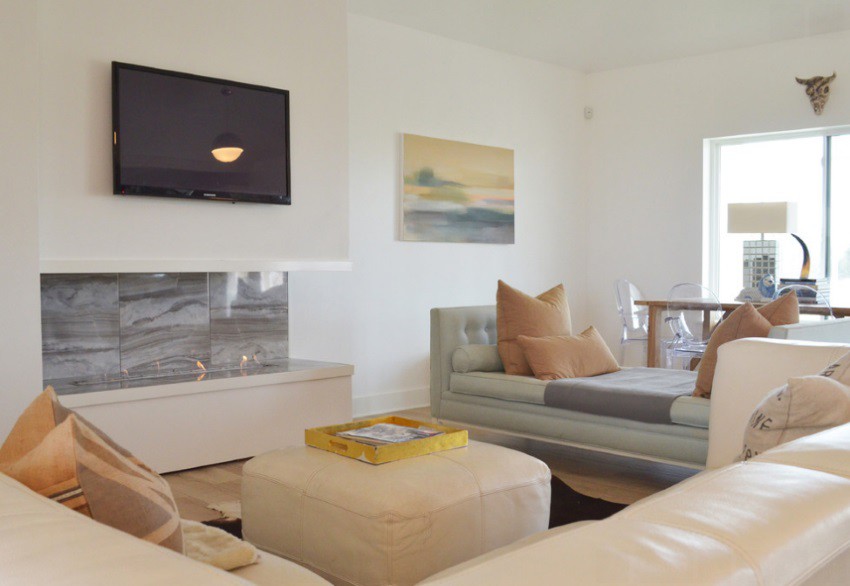 Marble fireplace in a room with comfy seating