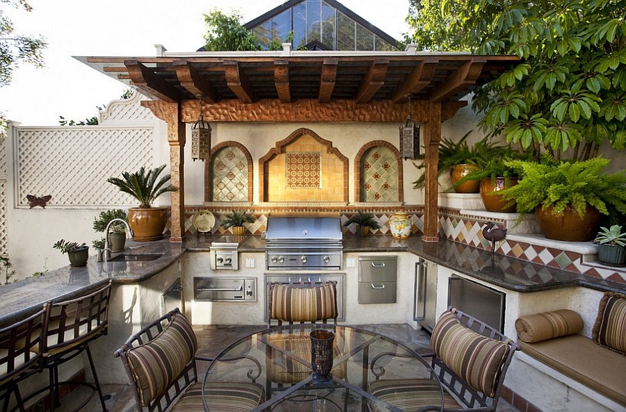 Mediterranean style outdoor space with a beautiful kitchen [Design: C & C Partners Design/Build]