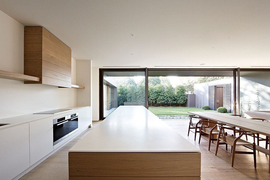 Minimal dining room and kitchen of the Bay House