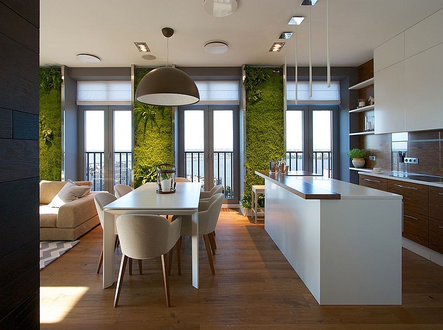 Oversized pendant light illuminates the small dining area