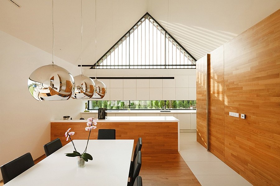 Pitched roof and airy interior give the home a grand appeal