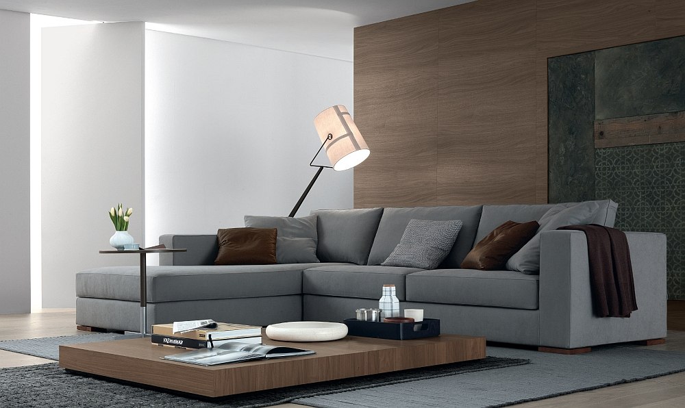 Plush grey sofa, low coffee table and floor lamp in the living room