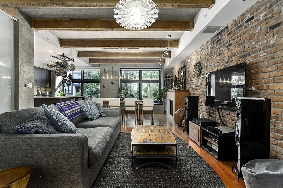 Raw concrete and exposed brick walls give the loft an eclectic appeal