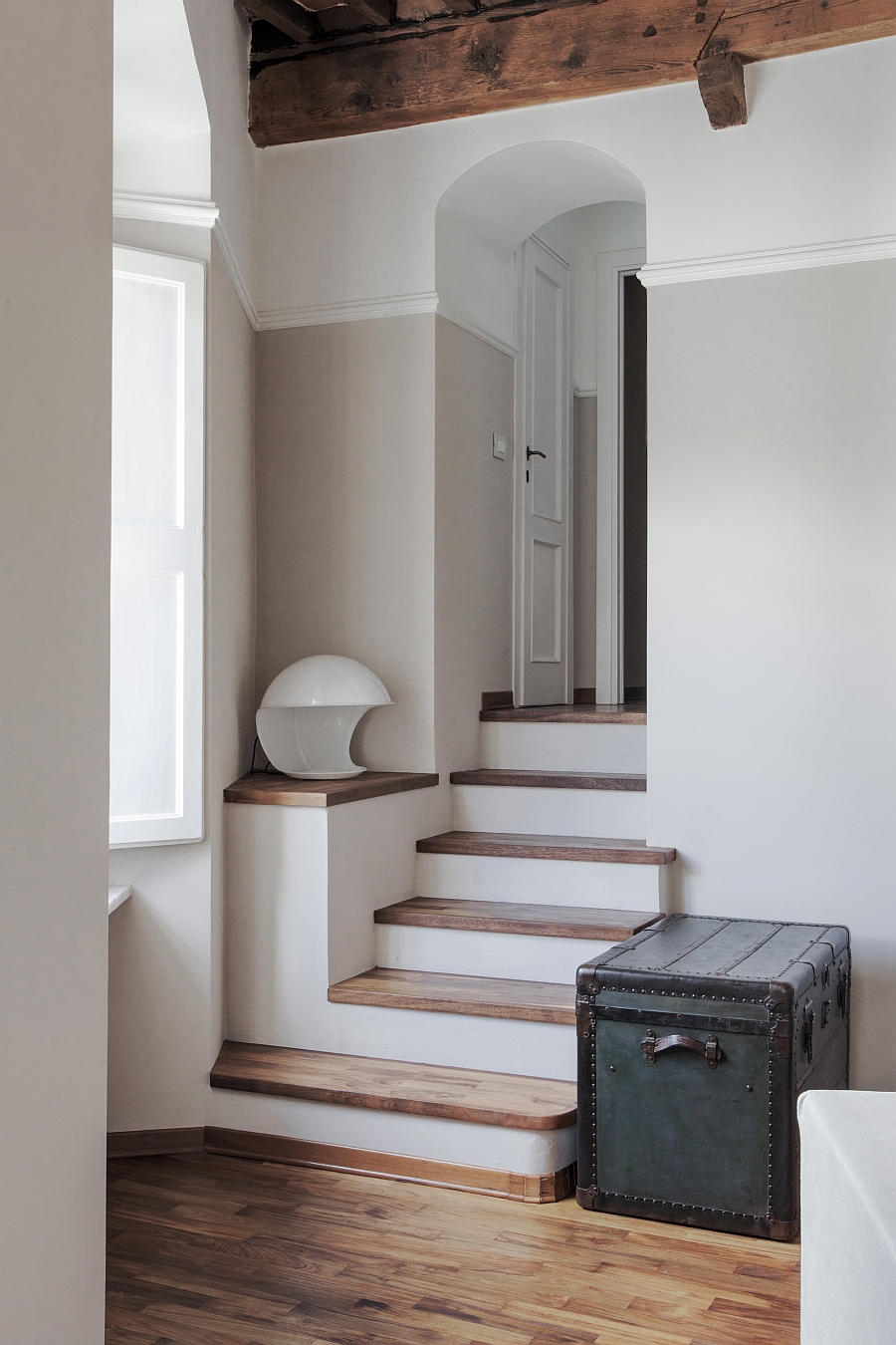 Revitalized old trunk stands out in the way to the bedrooms