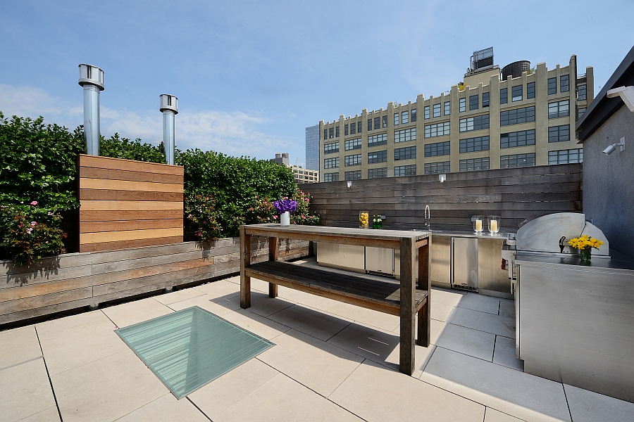 Rooftop lounge area with custom BBQ and full kitchen