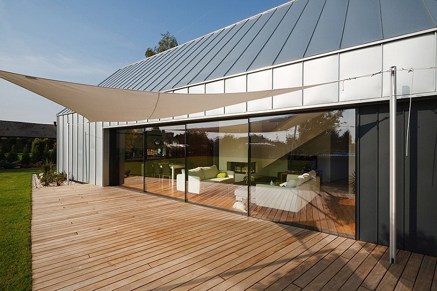 Shaded wooden deck connected visually with the living area