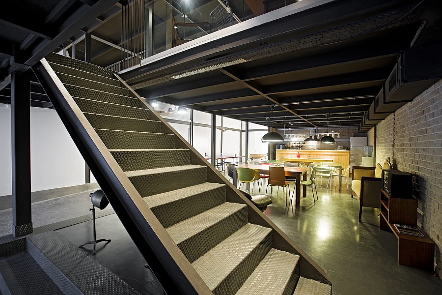 Sleek metallic staircase leading to the top level