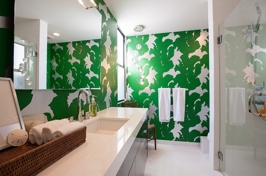 Small guest bathroom with bright green wallpaper shaping the accent wall