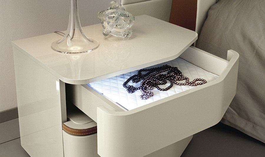 Specially crafted bedside tables with lovely contours and internal light