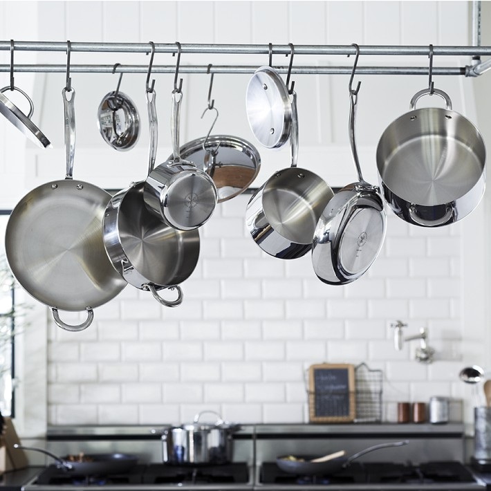 Stainless steel pots on a hanging rack