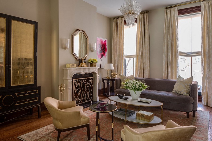 Stylish golden accents give the living room a touch of majestic allure