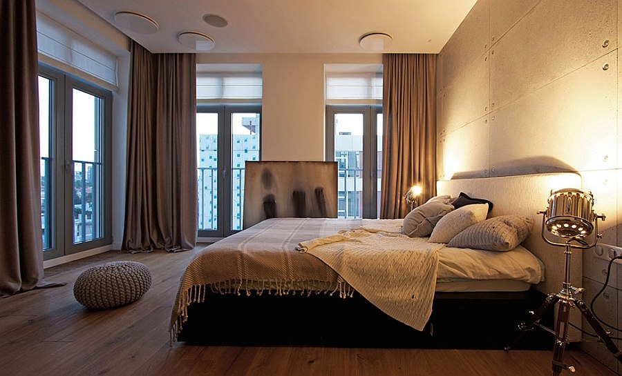 Tripod floor lamps used as bedside lighting