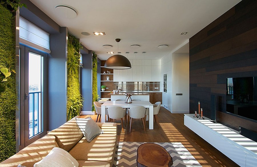 Vertical gardens in apartment living room coupled with natural colors