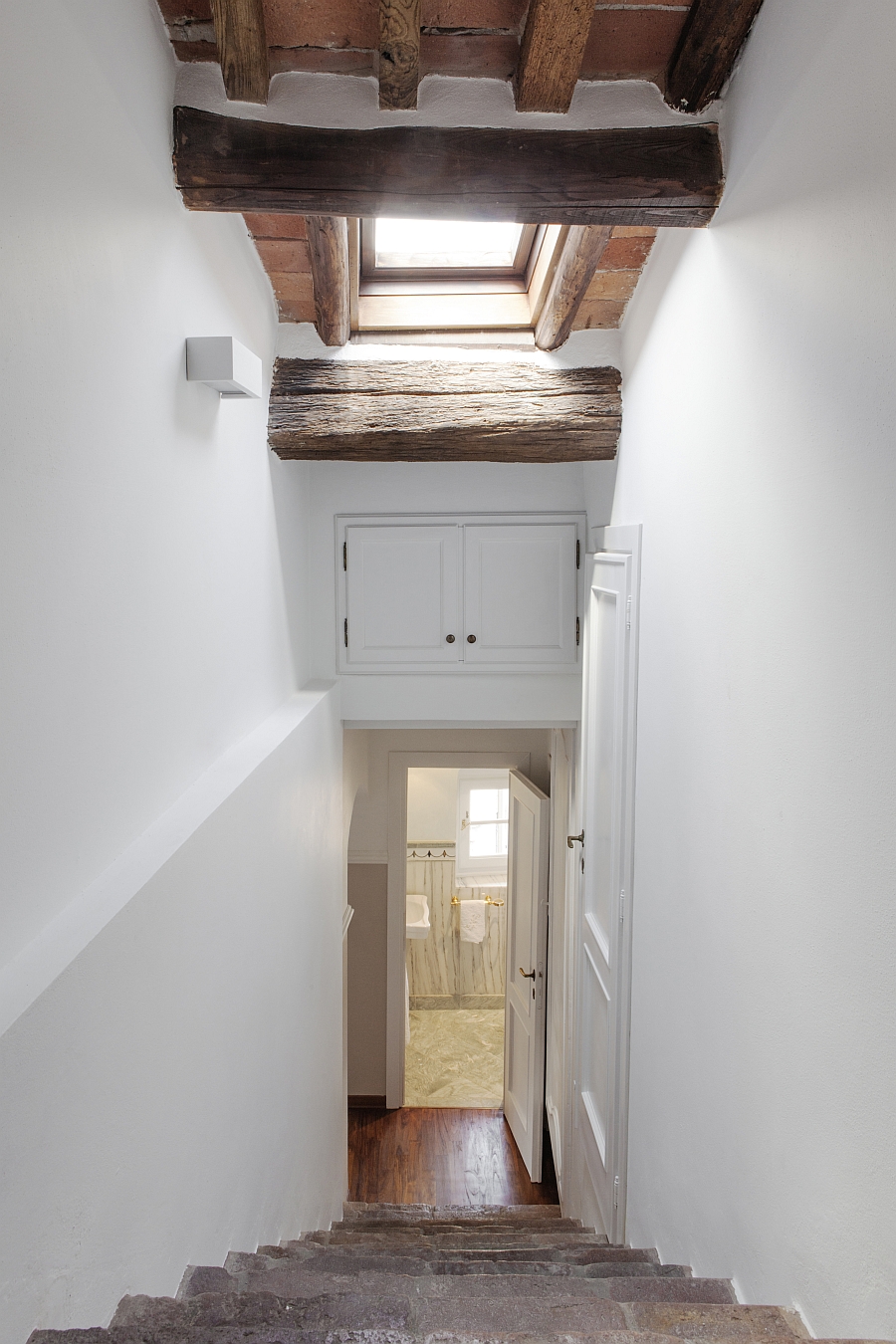 View of the bathroom down the staircase