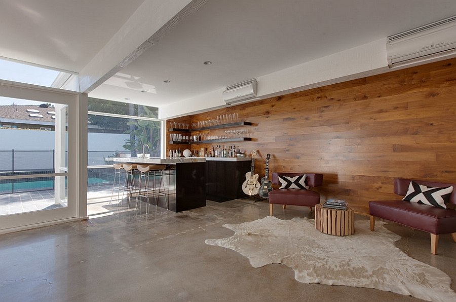 Walnut wood accent wall brings elegance to the home bar and lounge