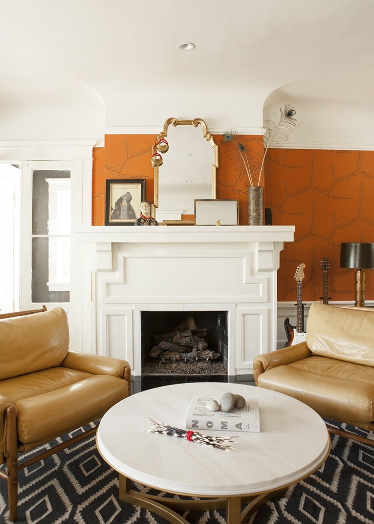 Warm tones and interesting details in a room with a fireplace