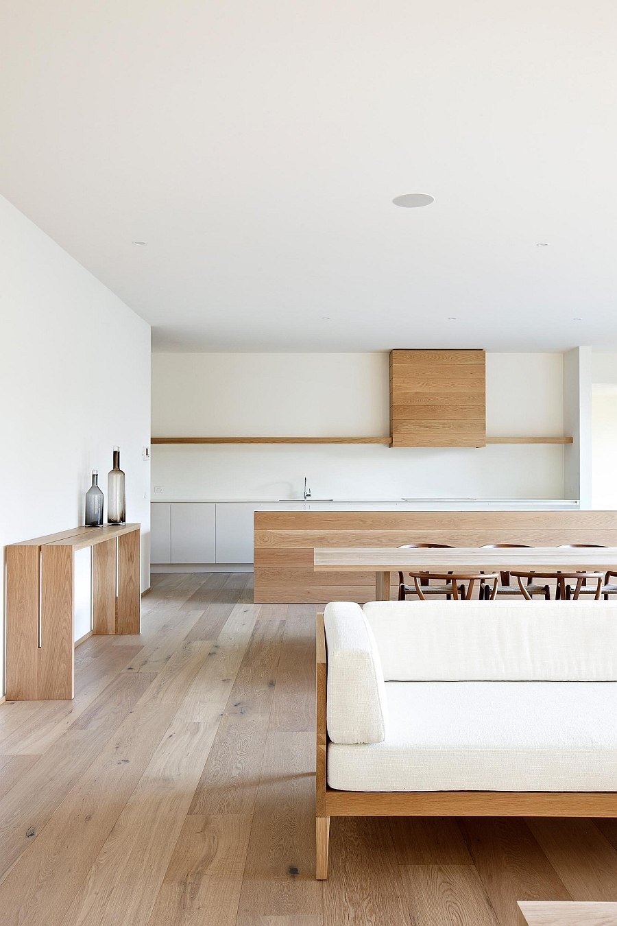 Warm wooden surfaces brighten the minimal interior